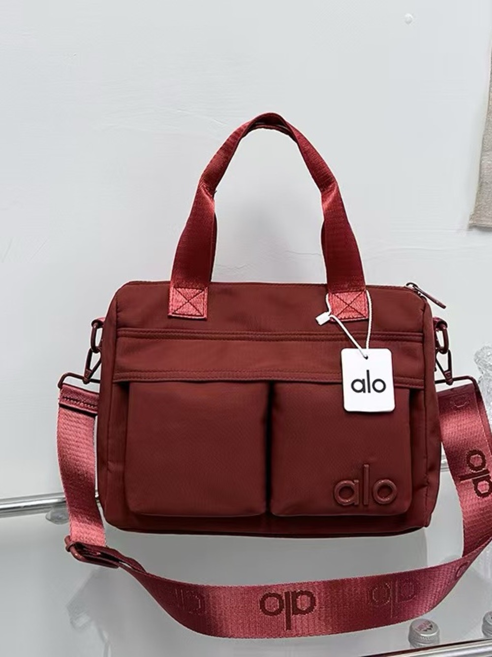 ALO Yoga Men's Deep Red Messenger Bag with Adjustable Strap